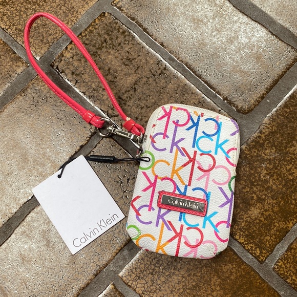 Calvin Klein Handbags - 🛍 6 for $35 • NWT Calvin Klein White Colorful Logo Print Tiny Wristlet - Flaw
